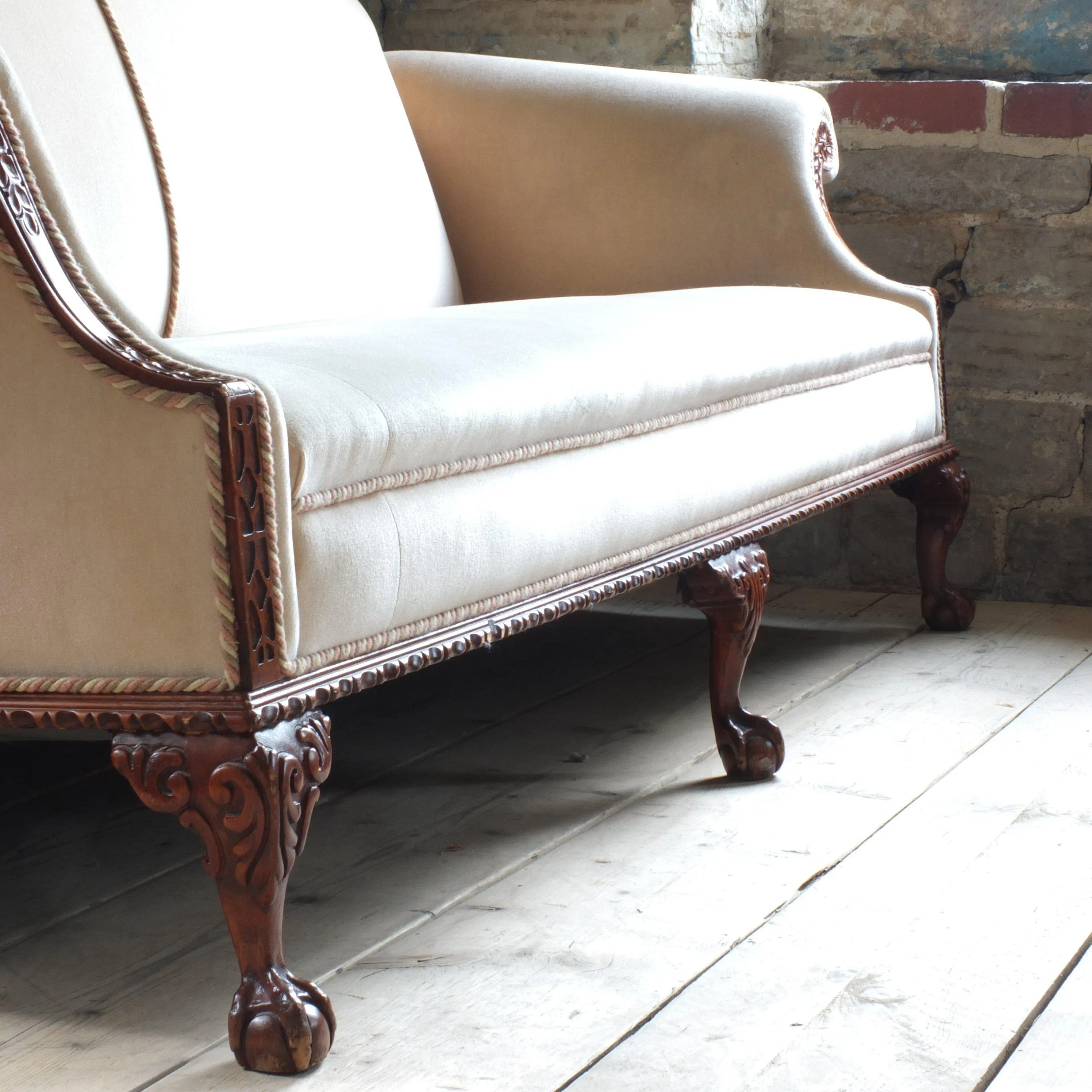 Antique early 20th century camel back sofa