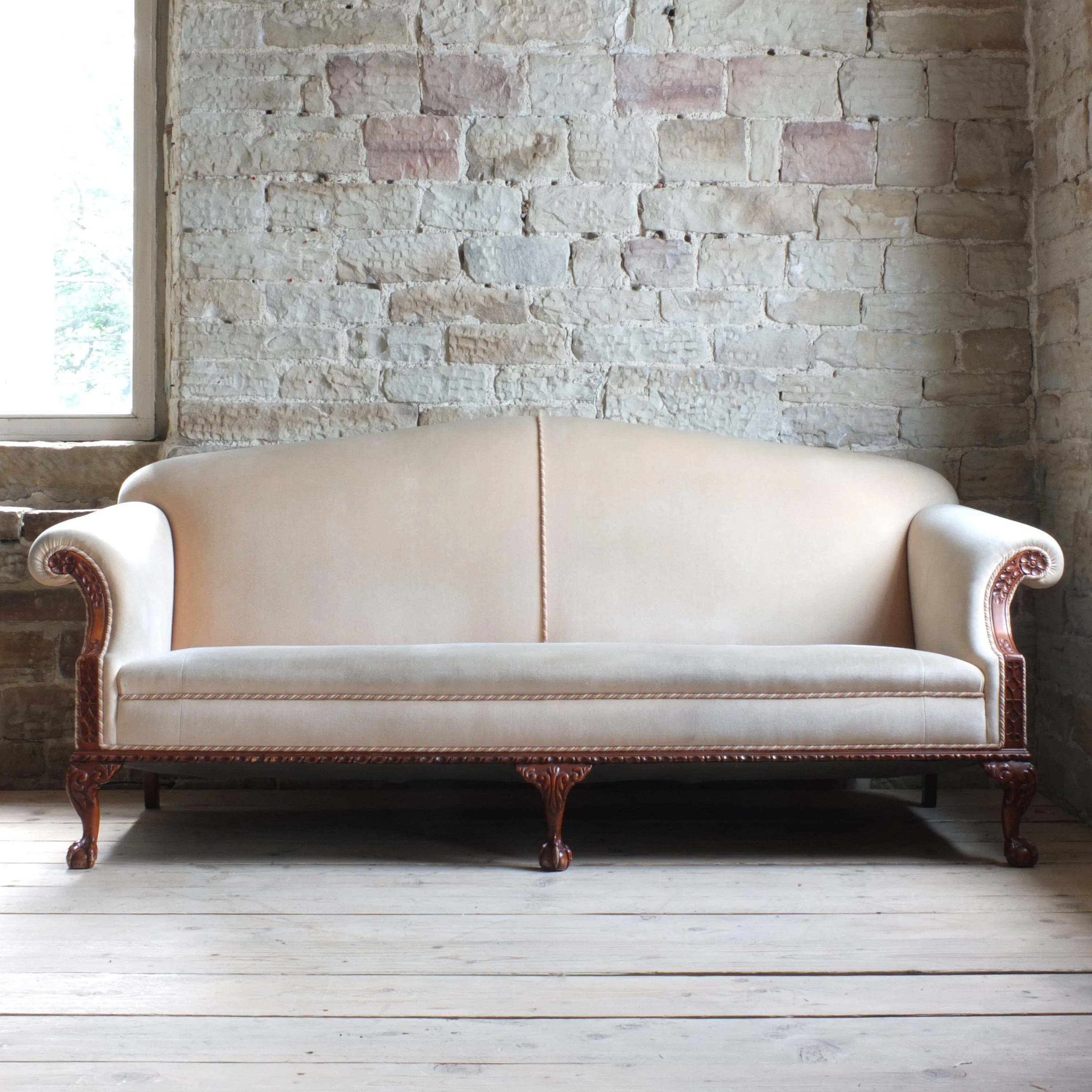 Antique early 20th century camel back sofa