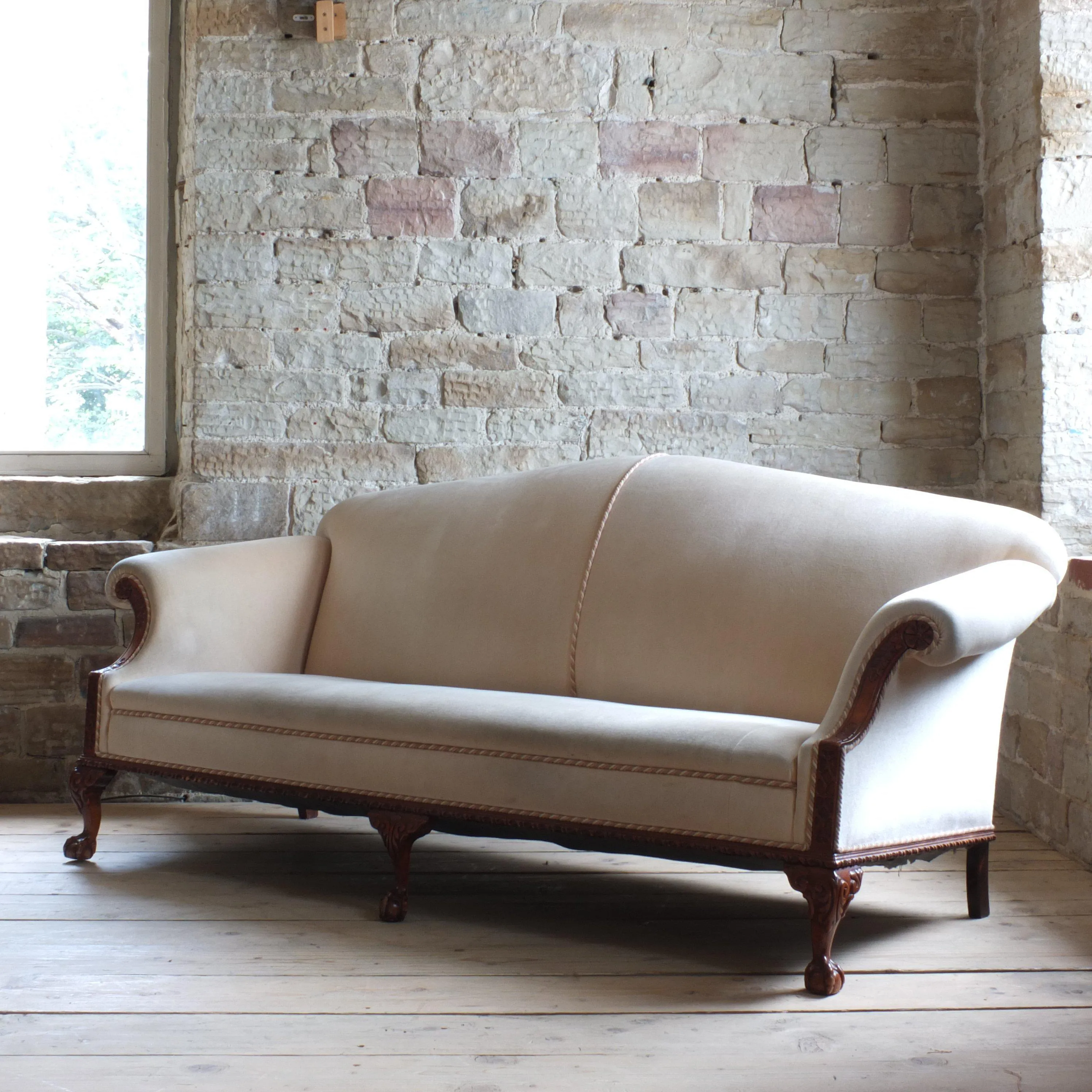 Antique early 20th century camel back sofa