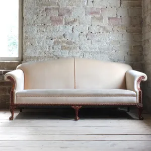 Antique early 20th century camel back sofa