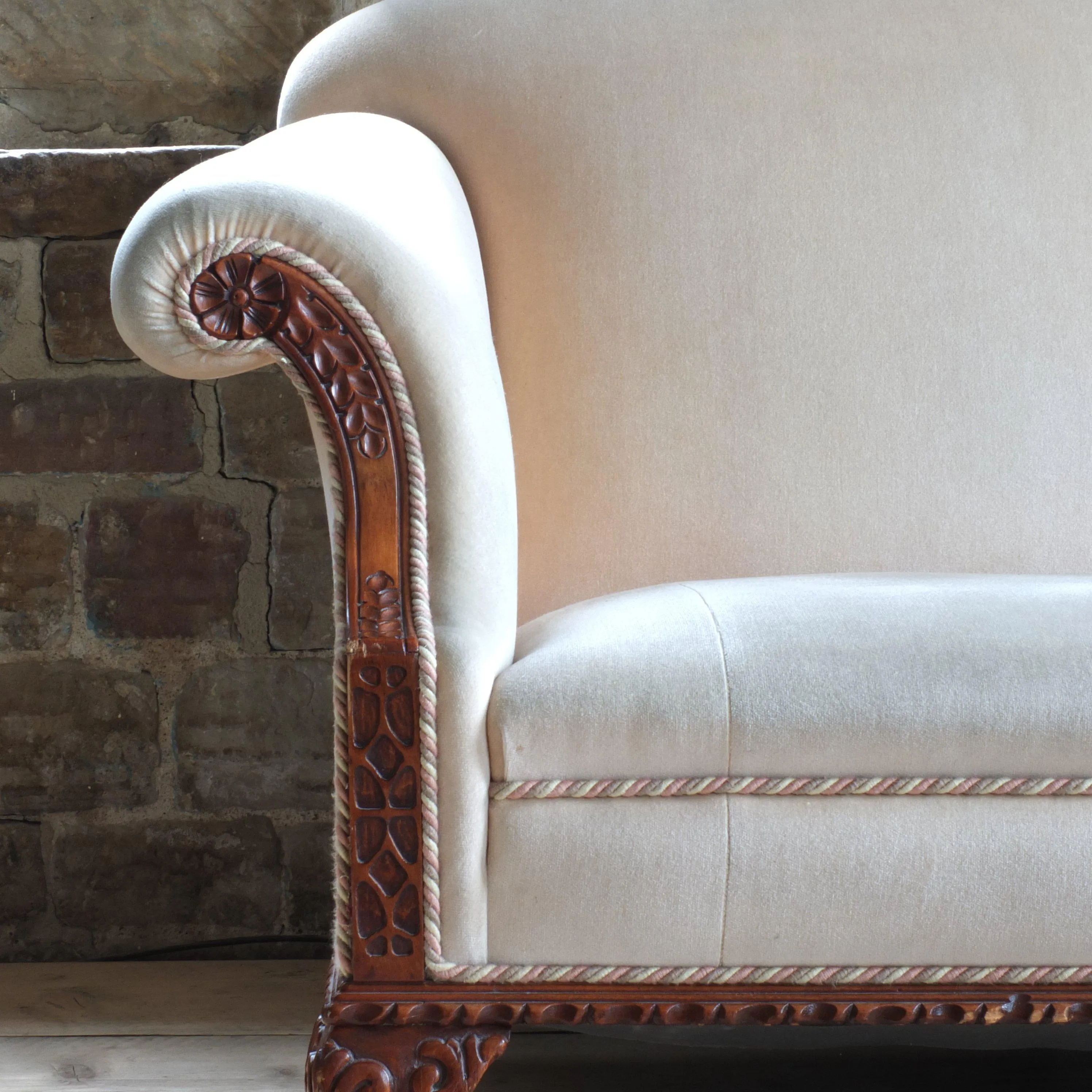 Antique early 20th century camel back sofa