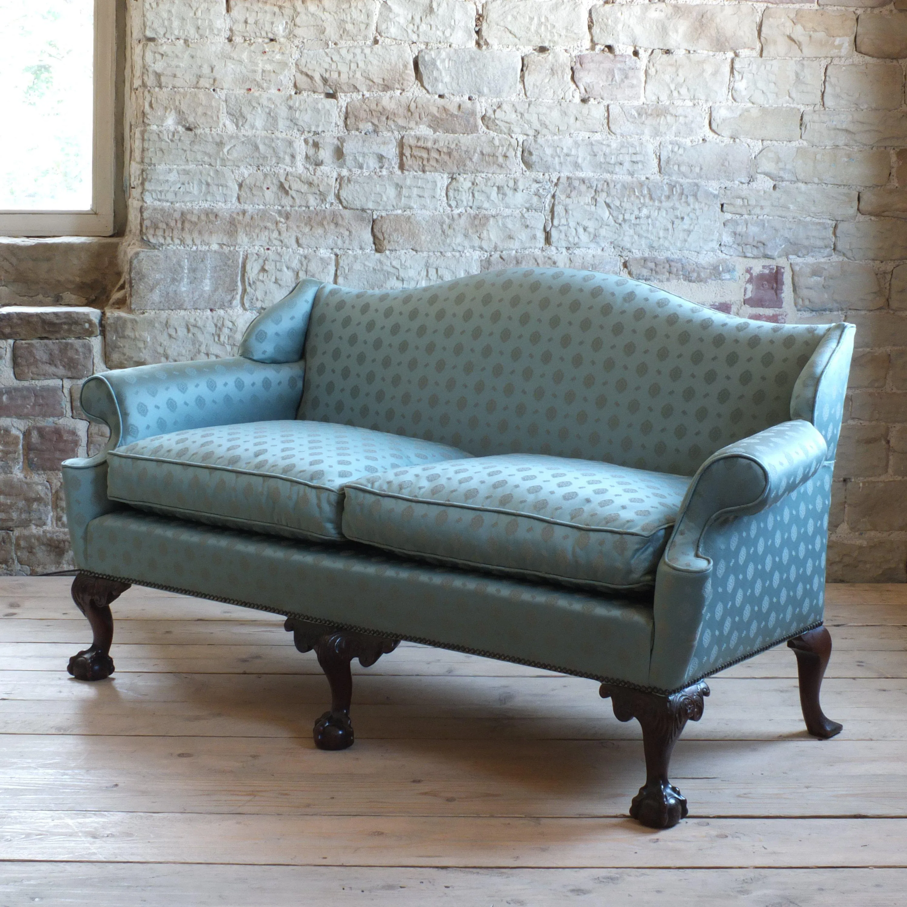 Early 20th century country house camel back sofa