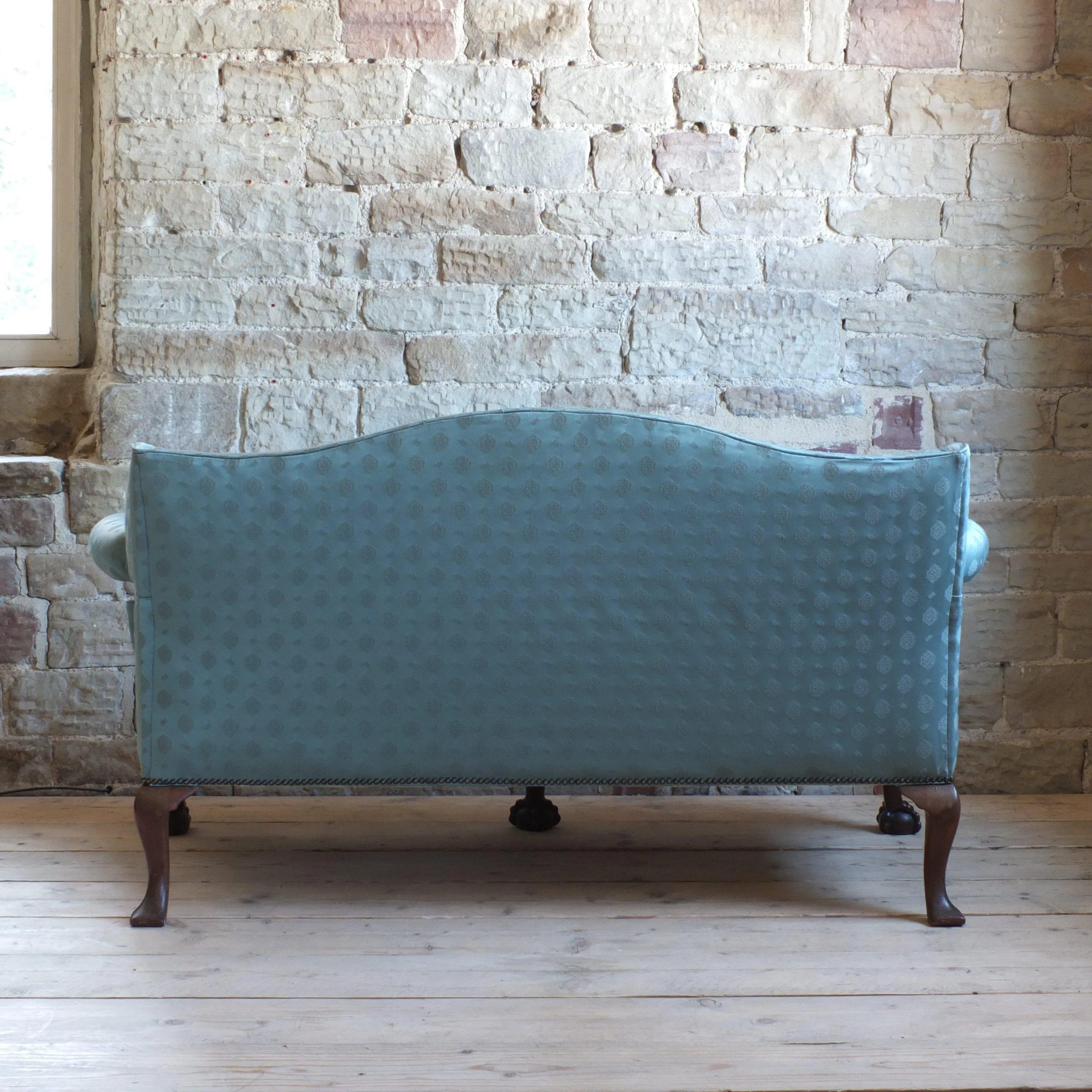 Early 20th century country house camel back sofa
