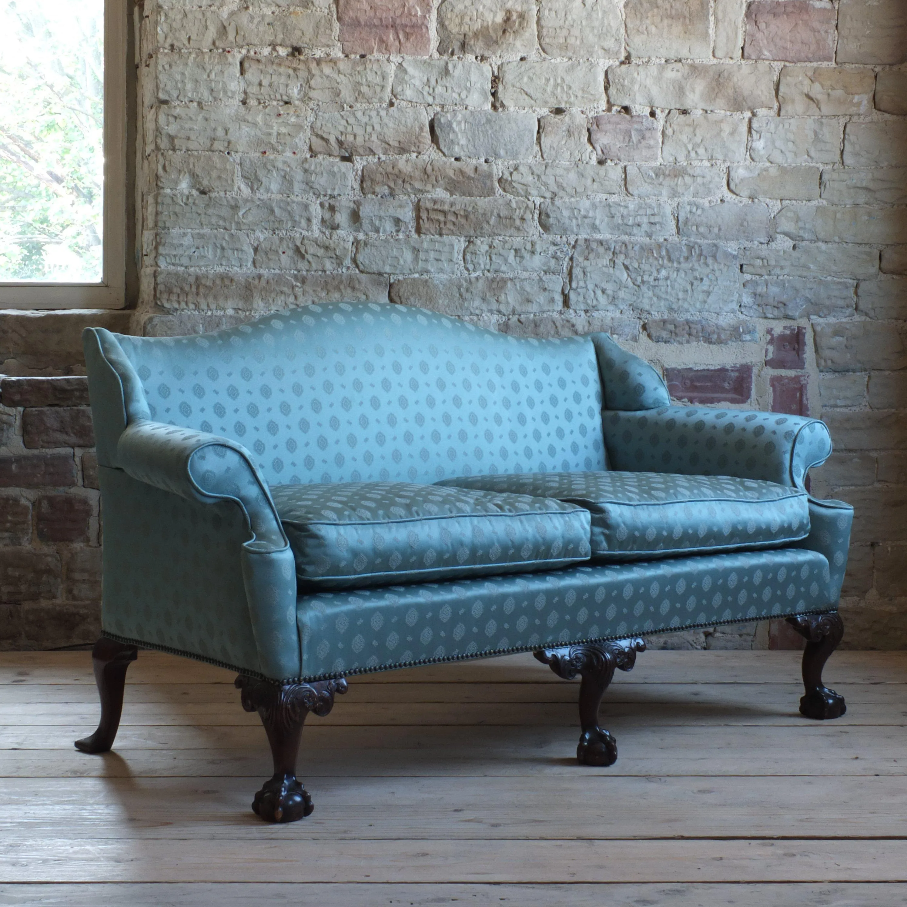 Early 20th century country house camel back sofa