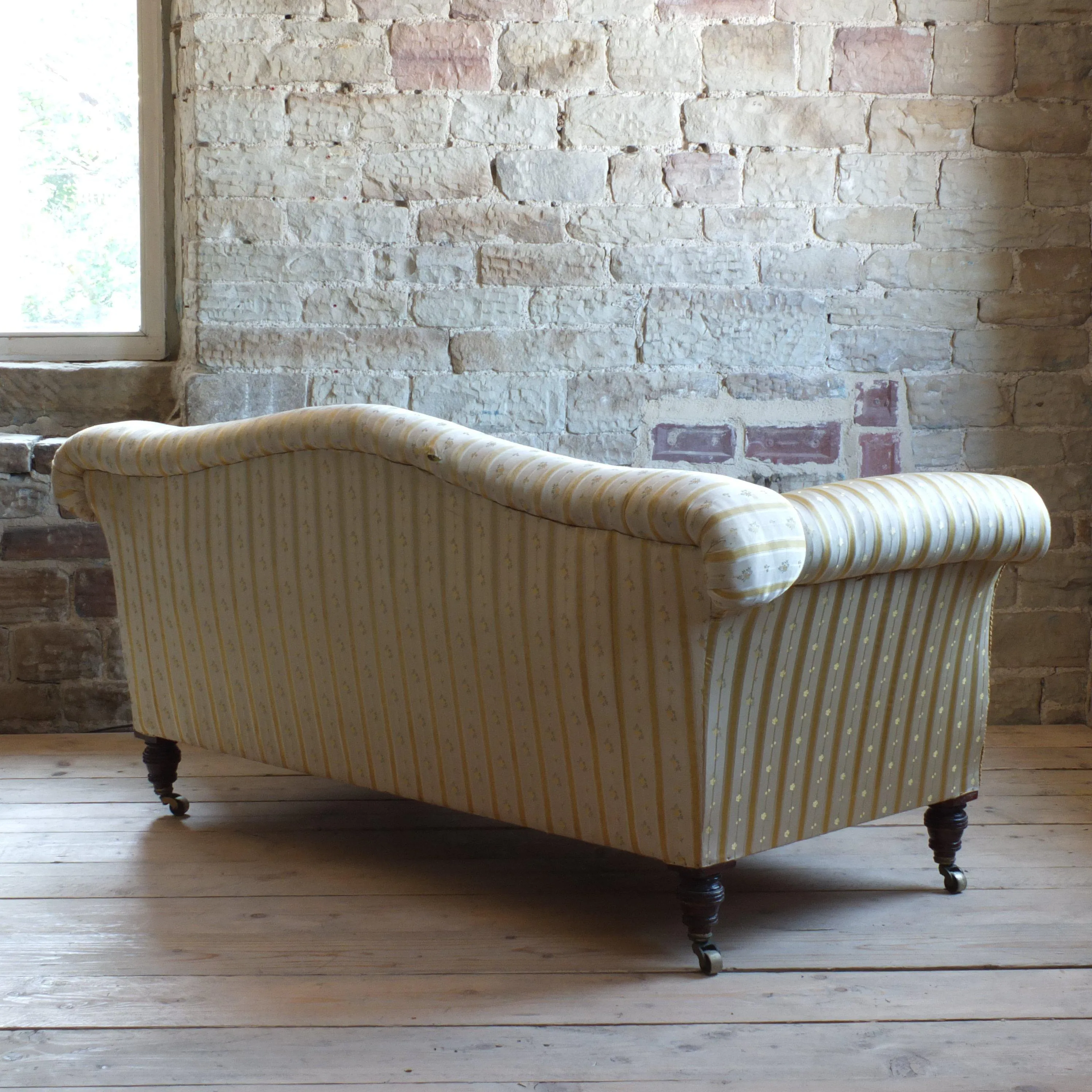 Victorian Howard style camel back sofa