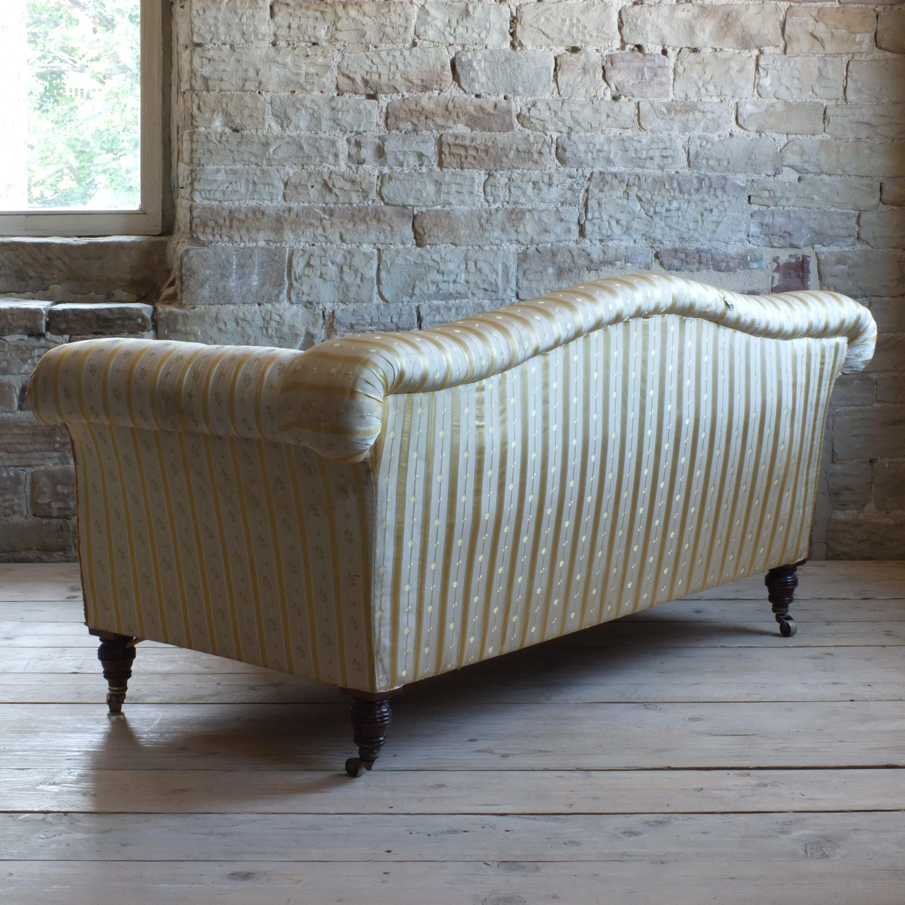 Victorian Howard style camel back sofa
