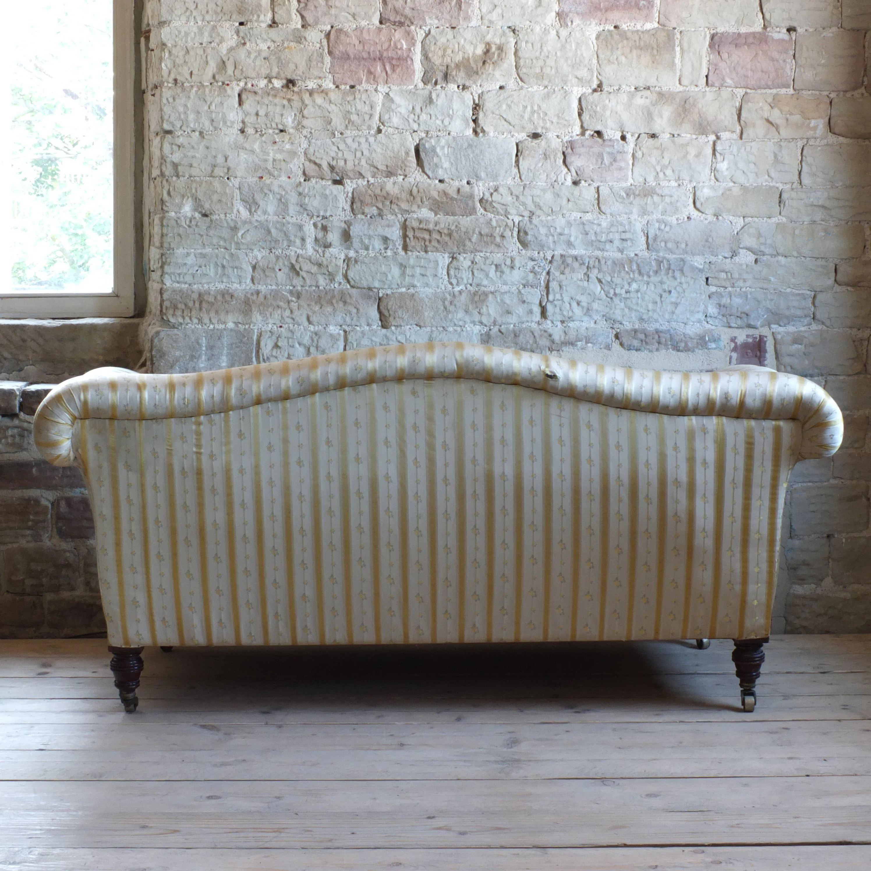 Victorian Howard style camel back sofa
